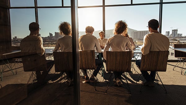 Business meeting in large open conference room