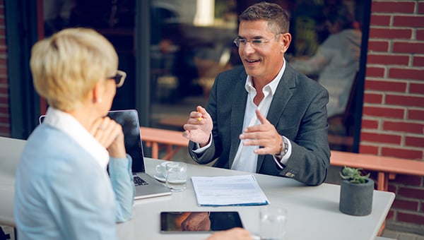 Two business people meeting informally.